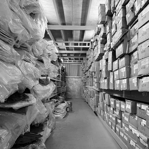 Warehouse aisle with boxed parts